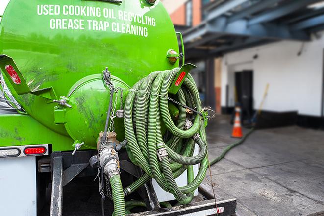 a service truck pumping grease from a restaurant's grease trap in Benicia